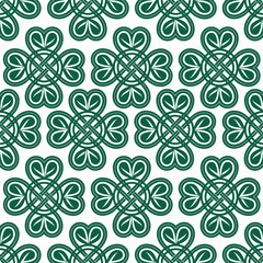 Authentic Celtic pattern with four-leaf clover. symbols of good luck on a light background.