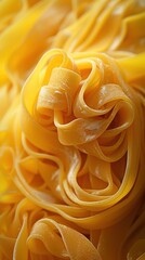 Freshly cooked fettuccine pasta twirling in golden strands ready for a delicious meal