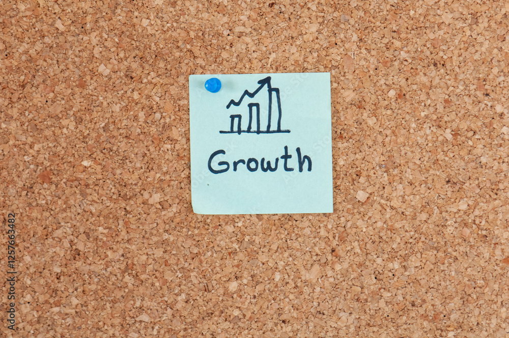 Aufkleber growth chart pinned to corkboard visually representing progress and development with hand-drawn grap