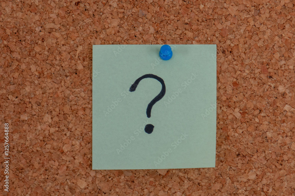 Poster a square light-green sticky note with a black question mark on it pinned to a corkboard with a blue 