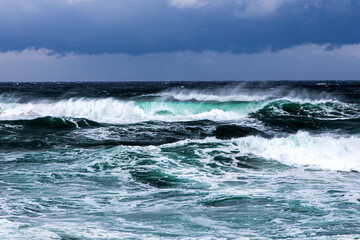 waves breaking on the shore