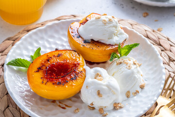 A plate of fruit with a scoop of ice cream on top