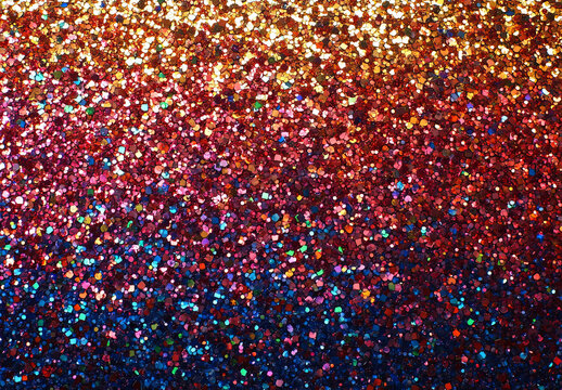 A sparkling rainbow glitter background, shimmering with vivid hues and tiny star-like glimmers, radiating joy and celebration.