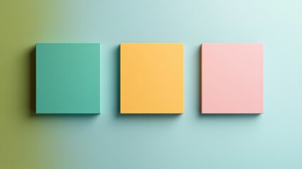 three colorful square blocks on a pastel background.