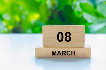 8 March text on wooden blocks. Calendar month concept and copy space with customizable space for text