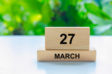 27 March text on wooden blocks. Calendar month concept and copy space with customizable space for text.