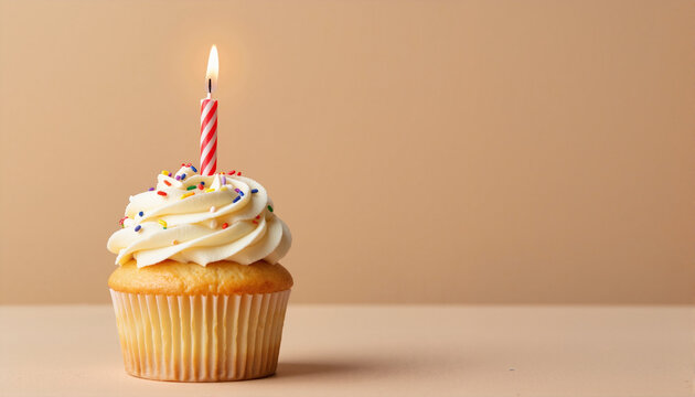 Cupcake with candle and sprinkles on a beige background for blogs, websites, birthday invitations, party decor, greeting cards, dessert recipes, and culinary presentations