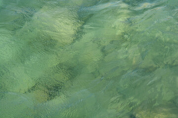 A close-up shot of the Adriatic Sea surface on a windy day, showcasing the dynamic interplay of...
