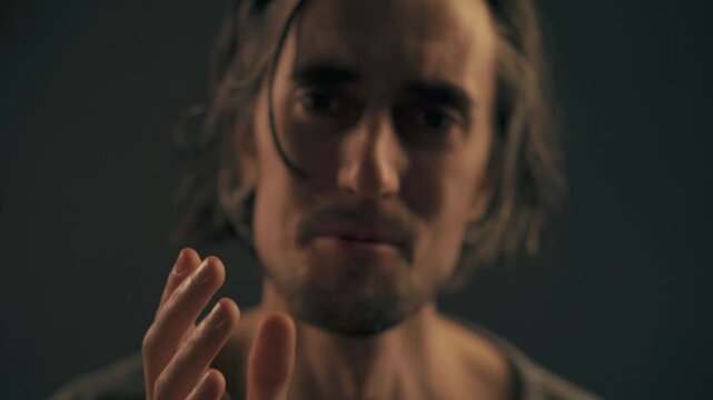 Slav Man Catching Kiss Tender Slav male captures a kiss in the air showcasing emotions of tenderness and sorrow in an atmospheric setting