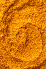 Smoothie of fresh fruits and berries, orange, banana, mango, sea buckthorn, cloudberry. Ice cream texture. Fruit yogurt ice cream. Delicious sweet dessert close-up as a background.