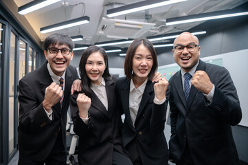 Obraz premium Business people, men and women, standing, posing, meeting in office, with documents, laptops and brainstorming, planning sales, digital marketing and growth strategies with colorful charts and graphs.