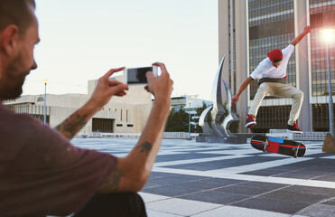 Man, skateboard and picture with camera for jump trick, content creation or vlog in an urban town...