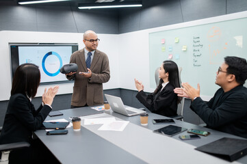 Male software developer, VR glasses system meeting in office with documents, laptop, sales...
