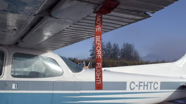 Remove Before Flight Tag on Aileron System of Cessna 172 Airplane