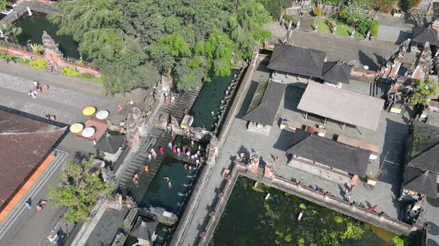 Aerial view of people during purification ritual at the Pura Tirta Empul Temple in Ubud, Bali, Indonesia