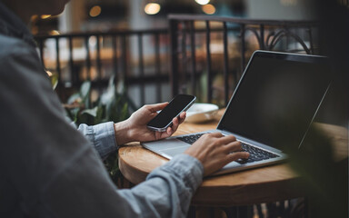 Person Working on Laptop in Cafe – Remote Job, Online Work & Freelancing.