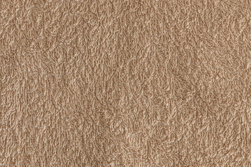 abstract background of beige terry towel texture close up
