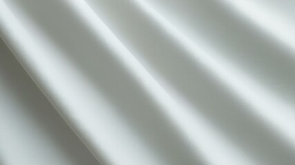 Elegant smooth white fabric draping softly, ideal for fashion or interior design projects