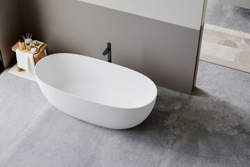 Minimalist bathroom with a modern freestanding white bathtub, black faucet, and wooden stool with...
