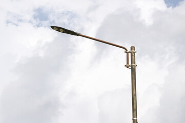Automatic street lamp pole with solar panel system over the clear blue sky background