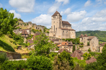 Old cliffside village of Saint-Cirq-Lapopie and his church in the Occitanie region of France