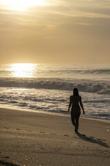 Girl silhouette on beach at dawn 7