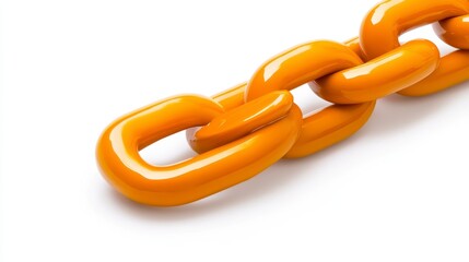 Fototapeta premium Close up view of a bright orange industrial chain link against a plain white background, showcasing the smooth, glossy surface of the links. The