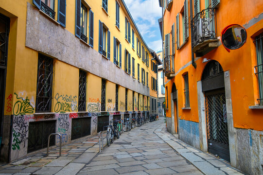 Milan, Italy. Traditional colorful building with balconies, shutter windows and multicolored walls in typical italian street	
