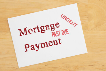 Mortgage Payment Past Due card on wood desk