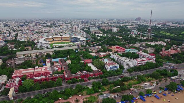 EZHILAGAM, public works department with chennai marina beach road and chidambaram stadium at triplicane, chennai, tamil nadu. daytime, pull back, drone shot, 4k.
