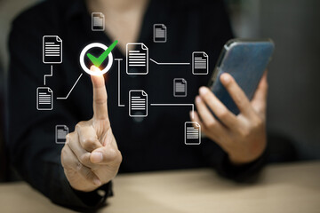 Person interacting with a digital document system, representing file management and auditing.