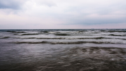 Winter storm. Small storm on winter sea. Seascape. Baltic sea in winter. Motion blur