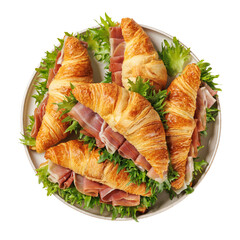 croissant sandwiches with ham and lettuce on plate