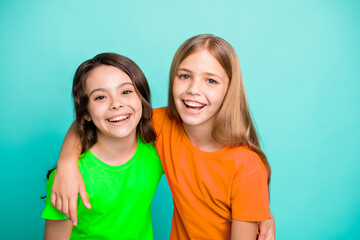Photo of two friendly kind amazing beautiful girls being glad to be photographed while isolated...