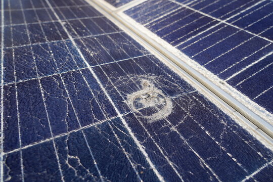 Broken solar panel with cracks.