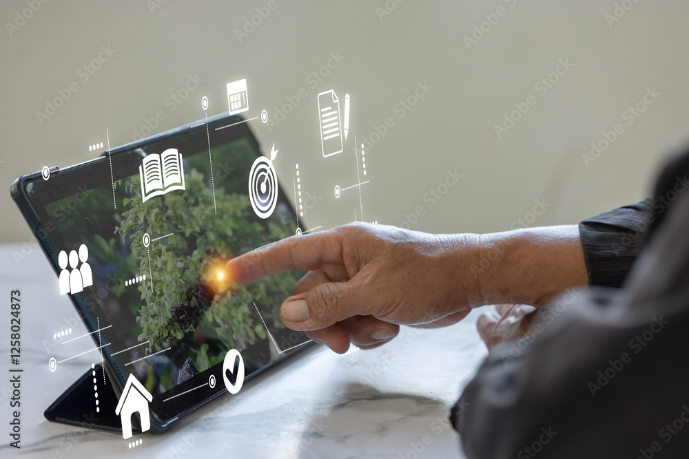 Aufkleber a hand interacting with a digital tablet displaying various online icons and data.