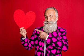 Photo of funky mature man cupid amour hold big paper heart shape indicating finger creative...