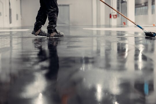 Epoxy floor coating in an industrial warehouse.