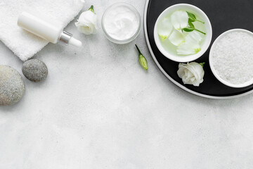 Set of cosmetic products on tray on the bathroom table