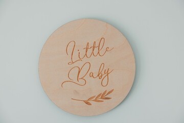 Wooden baby milestone marker with cursive script