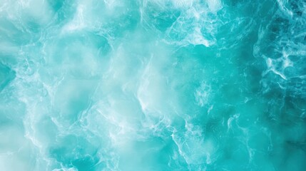 Fototapeta premium This image showcases gentle aqua waves flowing across a turquoise ocean surface, capturing a sense of calmness, serenity, and the sheer beauty of nature's simplicity and rhythmic movement.