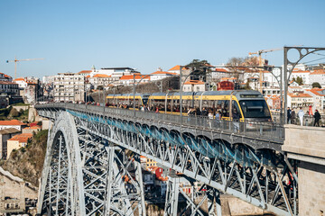 The Dom Luis I Bridge, a double-deck metal arch bridge that spans the river Douro between the...