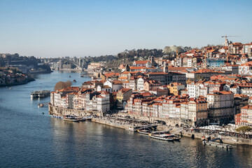 Porto, Portugal - December 28, 2024: View of the Douro River and the picturesque Ribeira district, a UNESCO World Heritage site