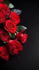 Obraz premium Luxurious Bouquet of Deep Red Roses on Black Background Romantic Floral Arrangement