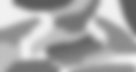 Blurred abstract grayscale grainy noise texture background with smooth gradient effect for design and print