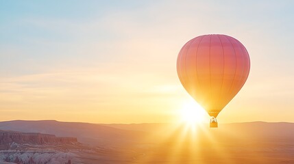 Fototapeta premium Floating Balloon Dream Amidst Golden Sunrise An Adventure in the Sky at Dawn Ascending into the Light