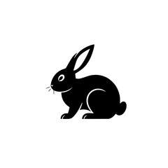 Black silhouette of a rabbit, shown in profile, sitting, on a bright white background.