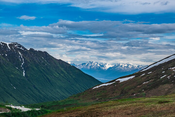 Naklejka premium Alaska wilderness with snowcapped mountains, rivers and lakes