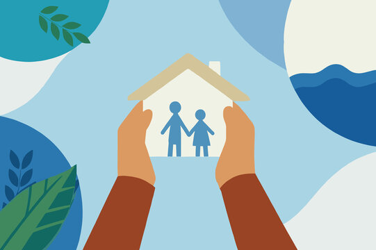 Holding a house illustration, representing family and real estate in a peaceful setting with nature elements