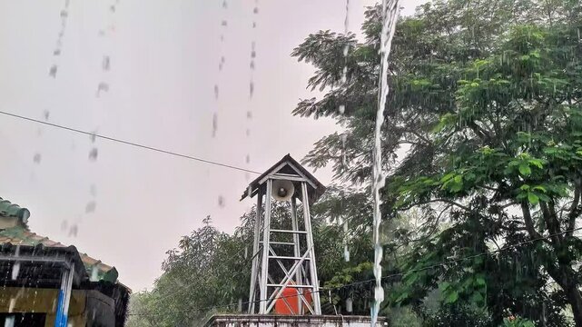 Heavy rain poured down on the loudspeaker tower